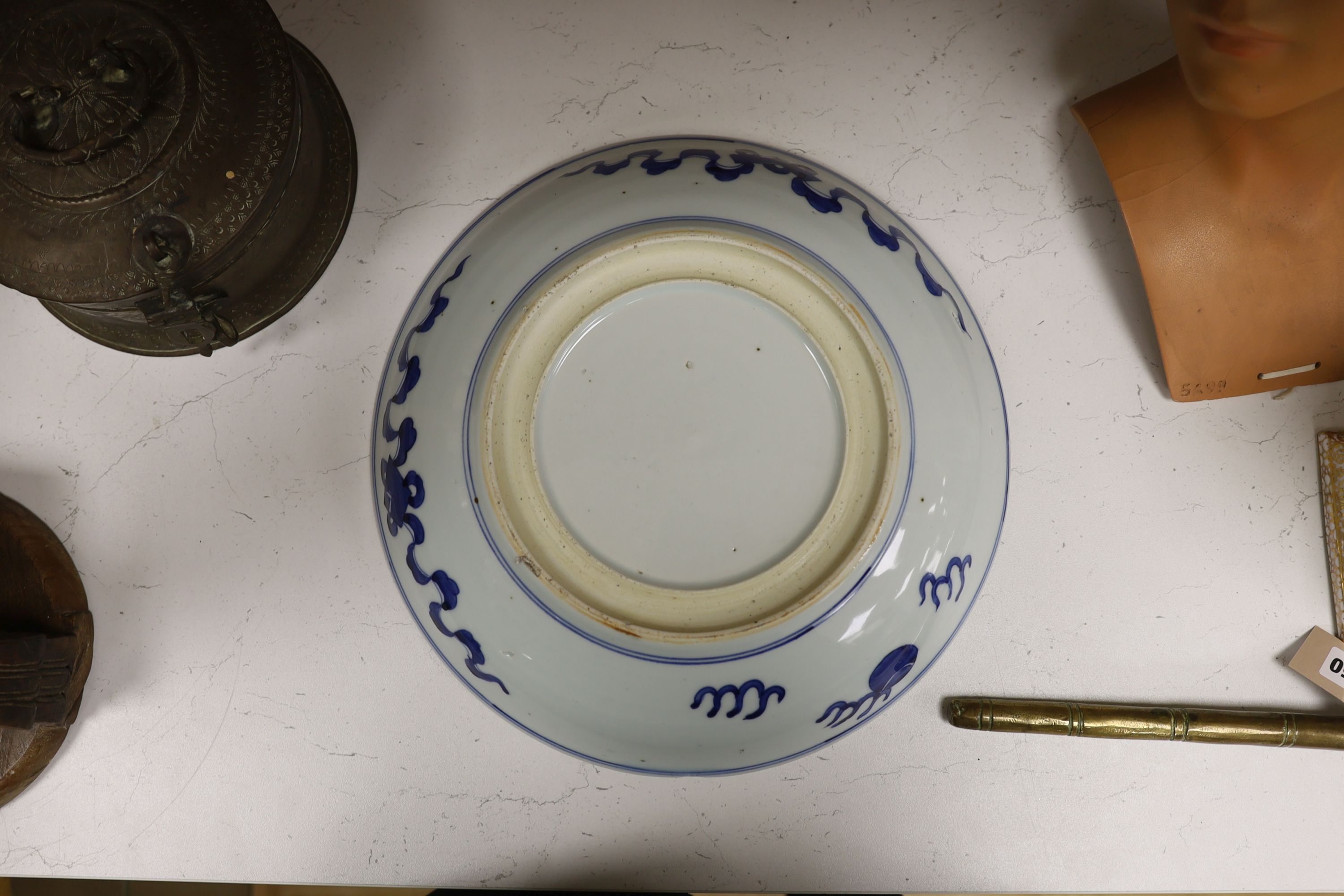 A Chinese blue and white ‘Buddhist lion’ dish, channel moulded foot, 36cm diameter